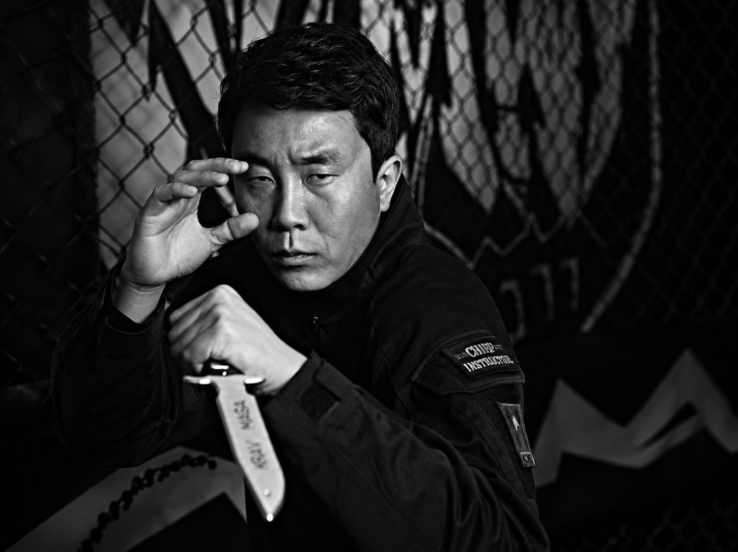 Master Eric Ku, Chief Instructor, in a knife-defense ready stance